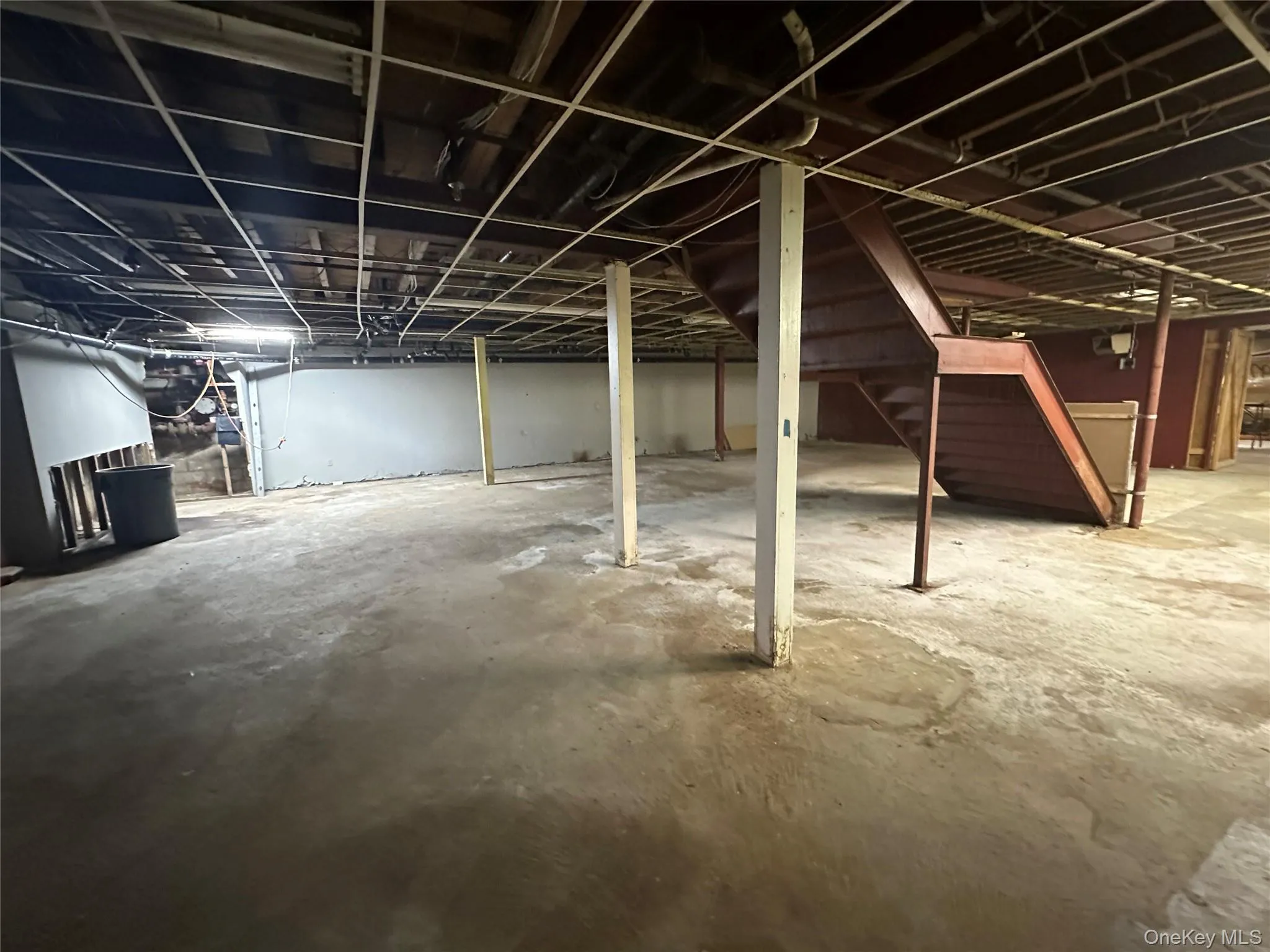 Unfinished basement with stairway Unfinished basement with stairway