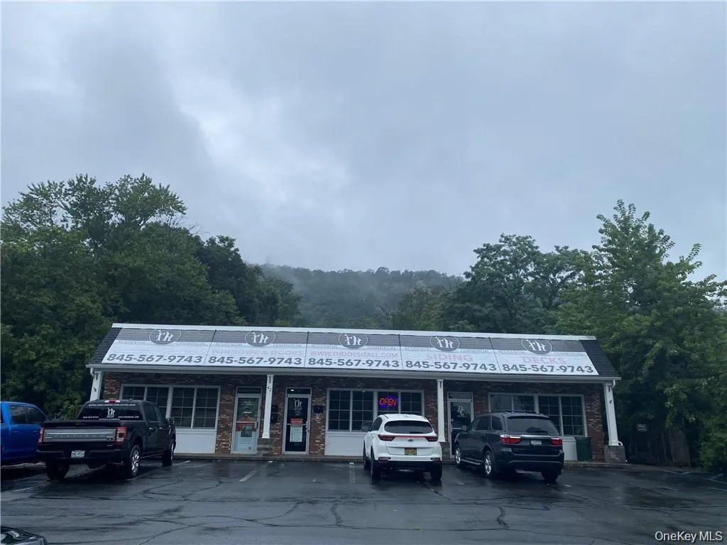 View of commercial location with uncovered parking View of commercial location with uncovered parking