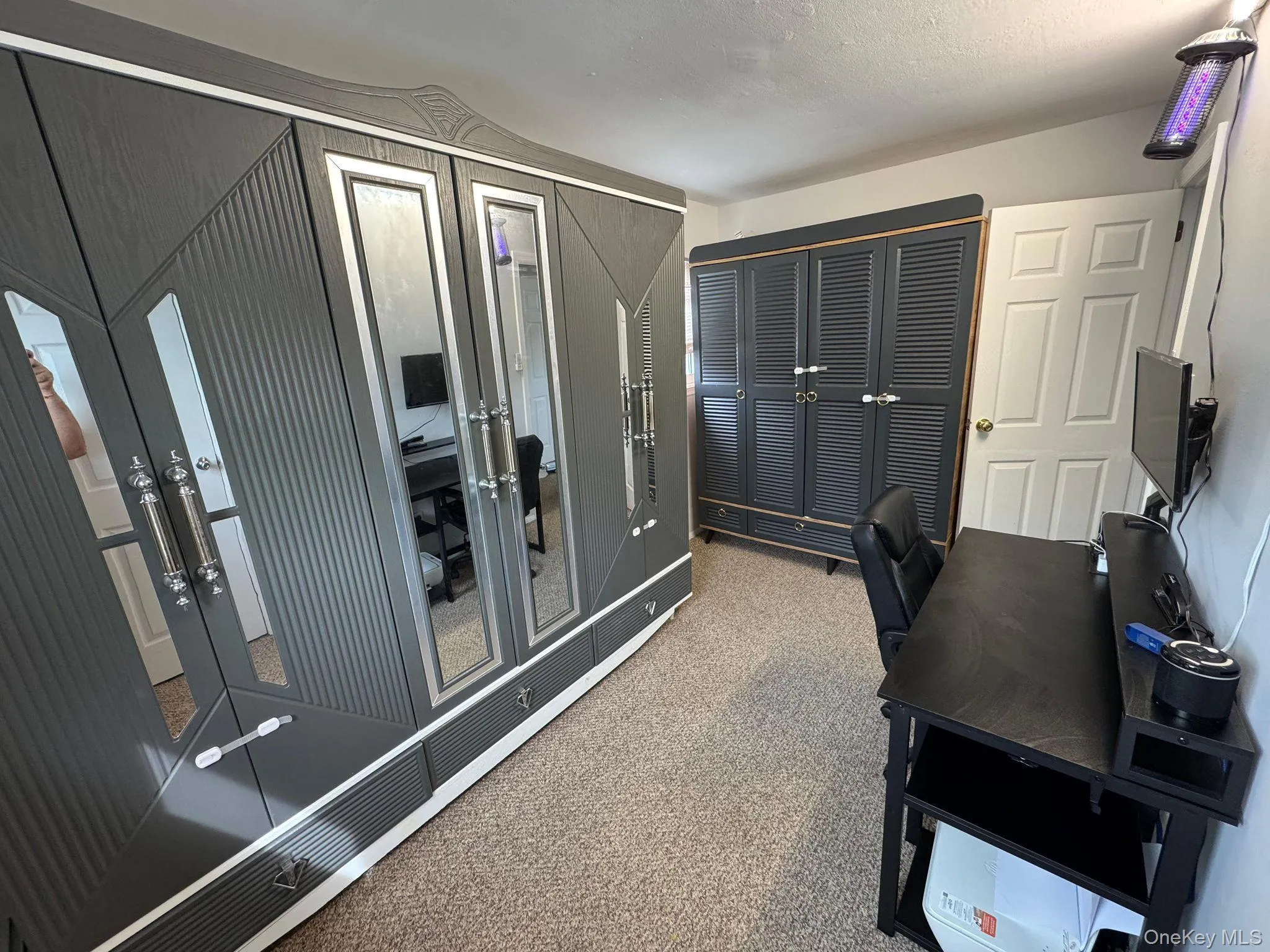 Carpeted office featuring french doors Carpeted office featuring french doors