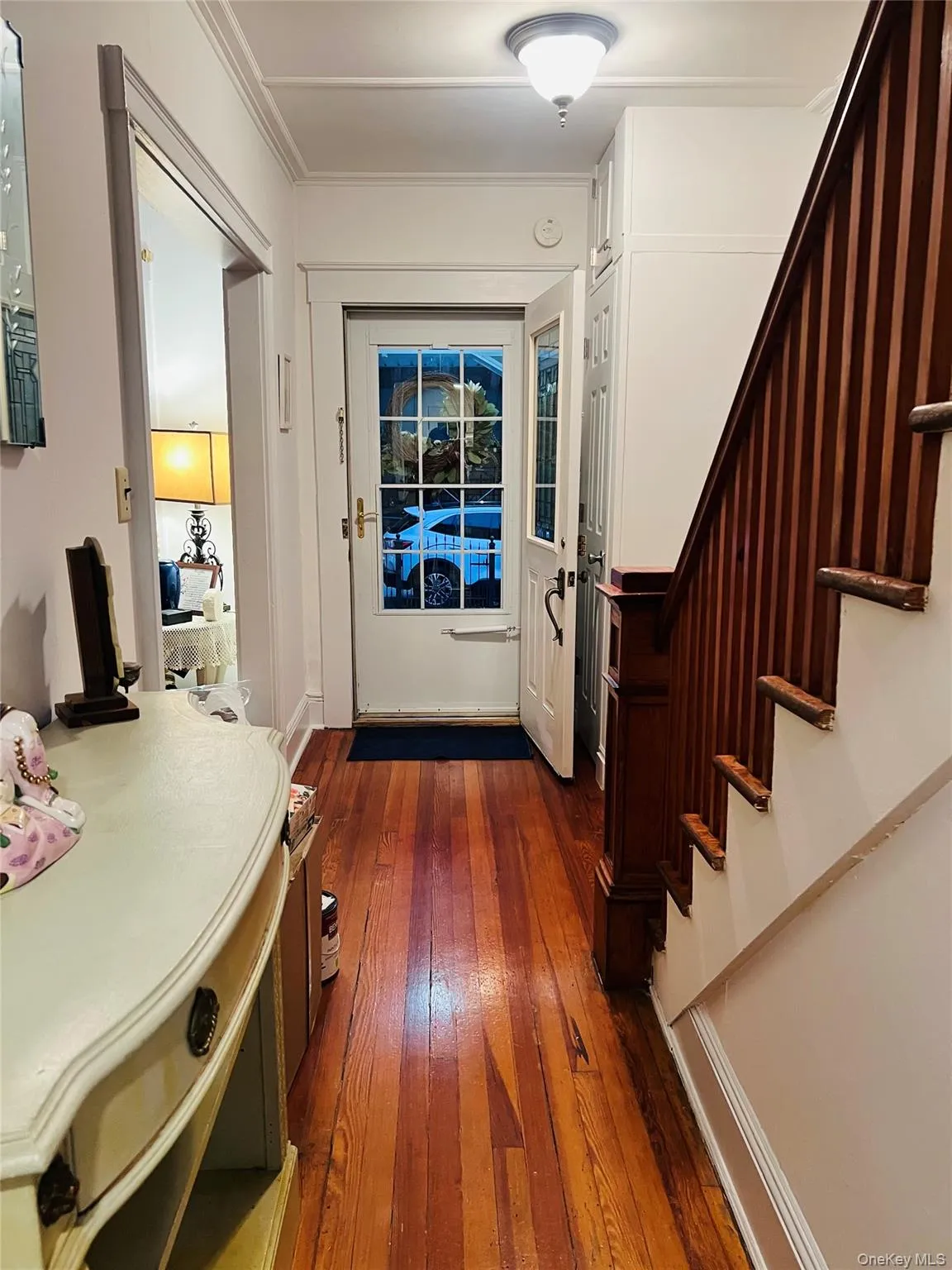 Entrance foyer with dark wood-style floors and stairs Entrance foyer with dark wood-style floors and stairs