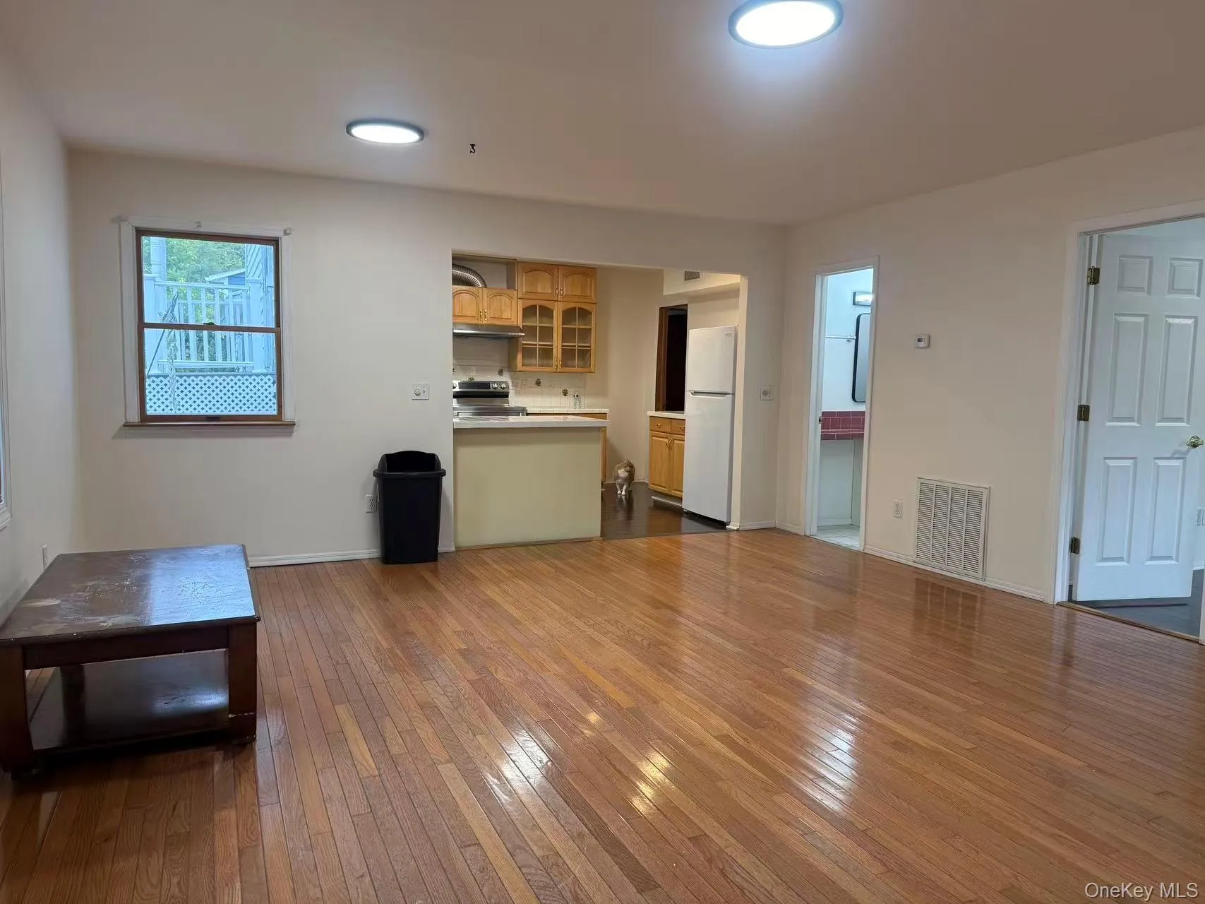 Unfurnished living room featuring dark wood-style floors and recessed lighting Unfurnished living room featuring dark wood-style floors and recessed lighting
