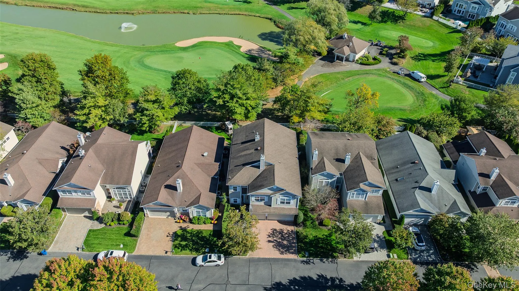 View of property location featuring a large body of water and a golf club View of property location featuring a large body of water and a golf club