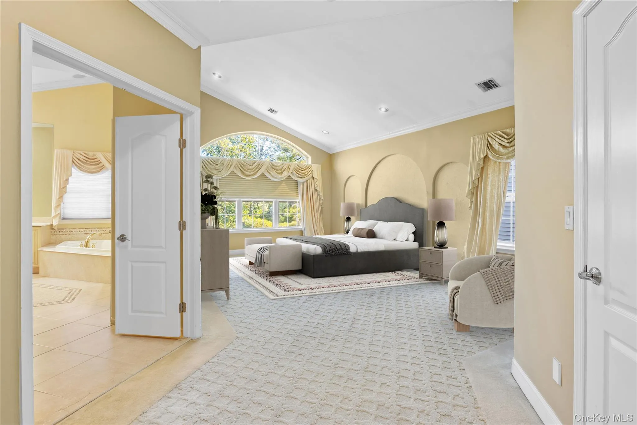 Bedroom with vaulted ceiling, light tile patterned floors, ornamental molding, light colored carpet, and recessed lighting Bedroom with vaulted ceiling, light tile patterned floors, ornamental molding, light colored carpet, and recessed lighting