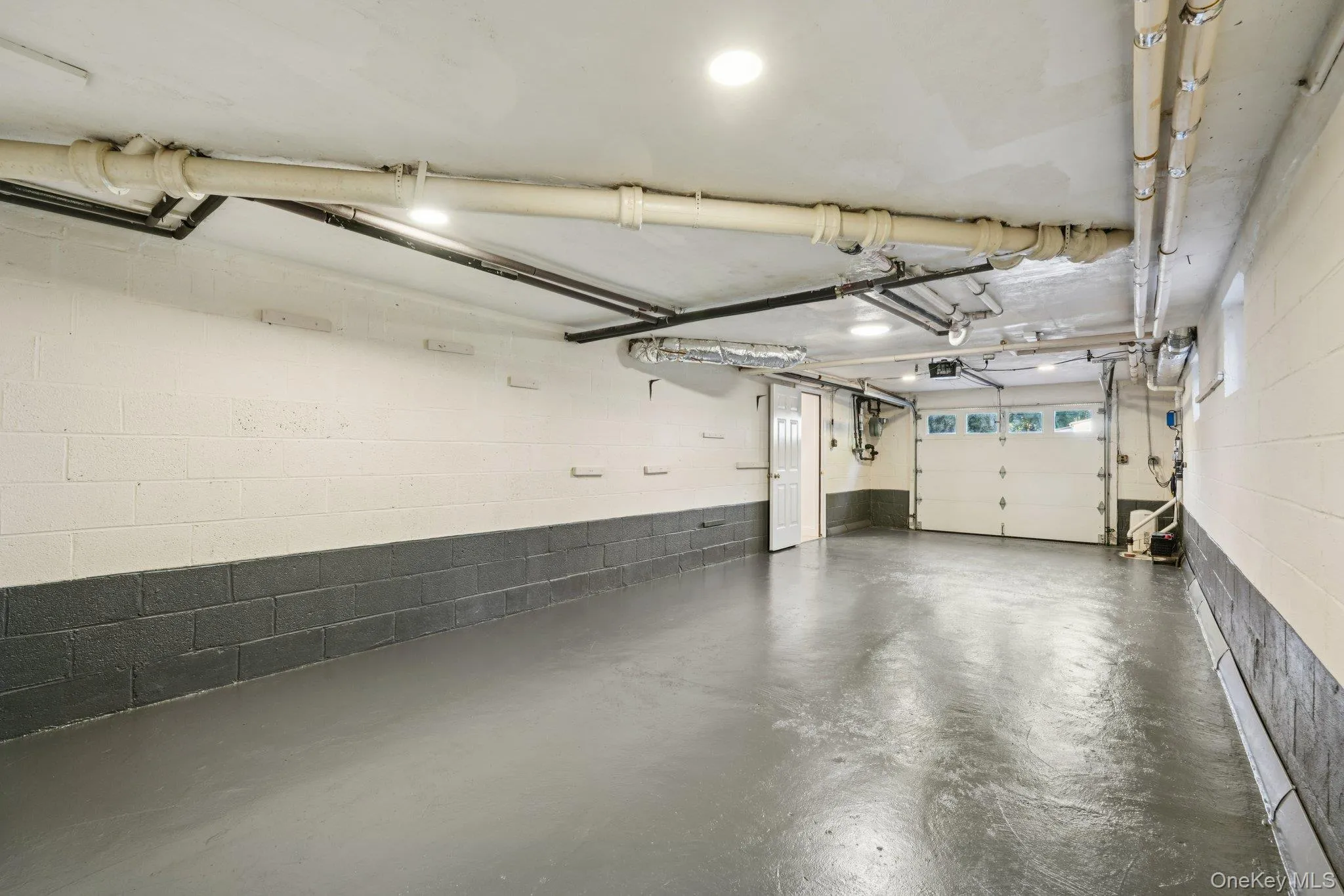 Garage featuring concrete block wall Garage featuring concrete block wall
