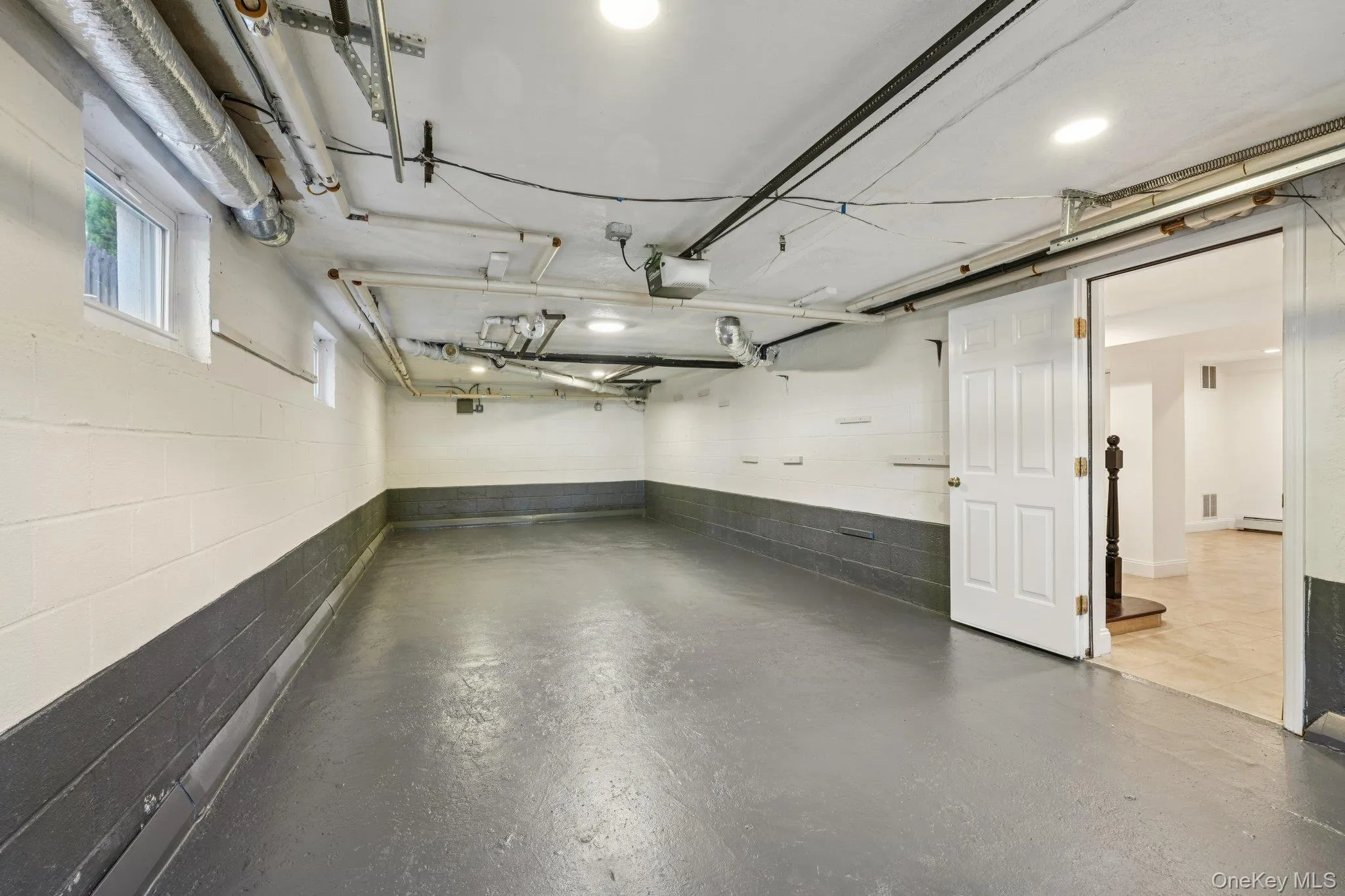 Garage with concrete block wall and a garage door opener Garage with concrete block wall and a garage door opener