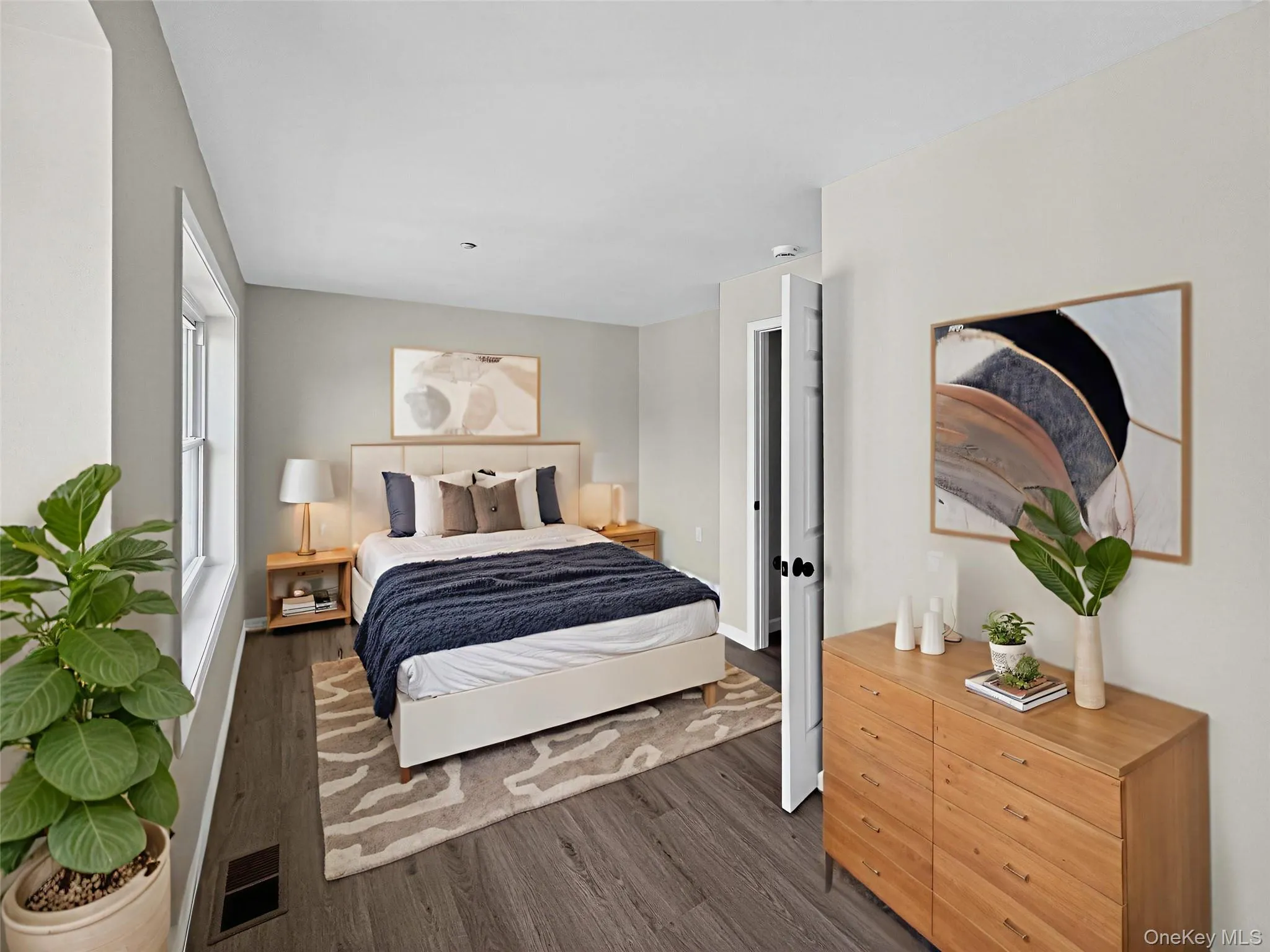 Bedroom featuring wood finished floors Bedroom featuring wood finished floors