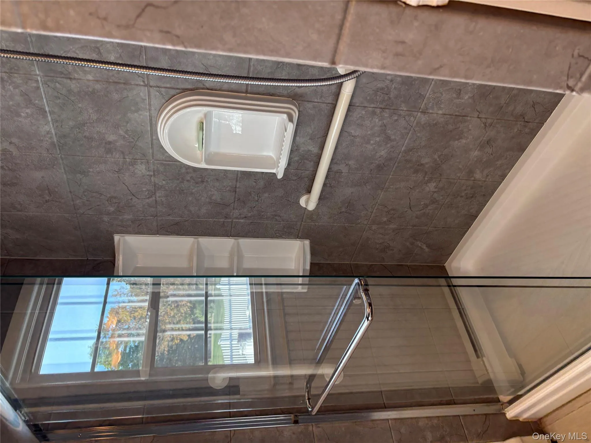 Bathroom featuring a shower stall Bathroom featuring a shower stall