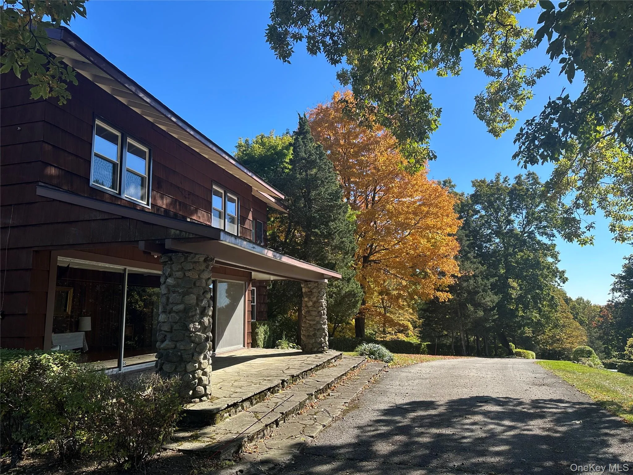 View of side of property featuring a patio area View of side of property featuring a patio area