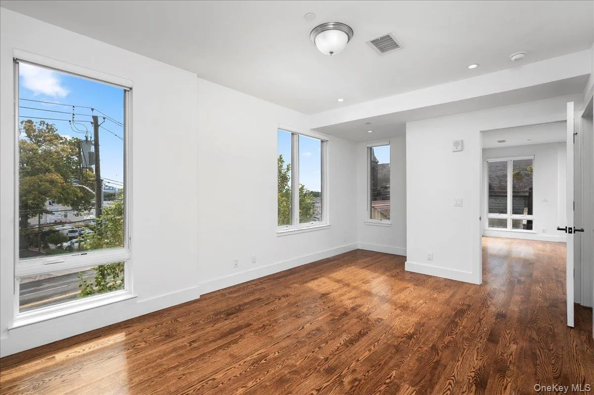 Master bedroom featuring plenty of natural light, dark wood finished floors, and recessed lighting Master bedroom featuring plenty of natural light, dark wood finished floors, and recessed lighting