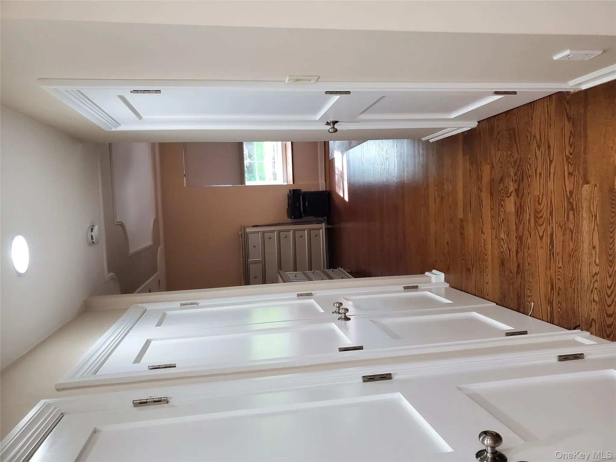 Hallway featuring dark wood-style flooring and recessed lighting Hallway featuring dark wood-style flooring and recessed lighting