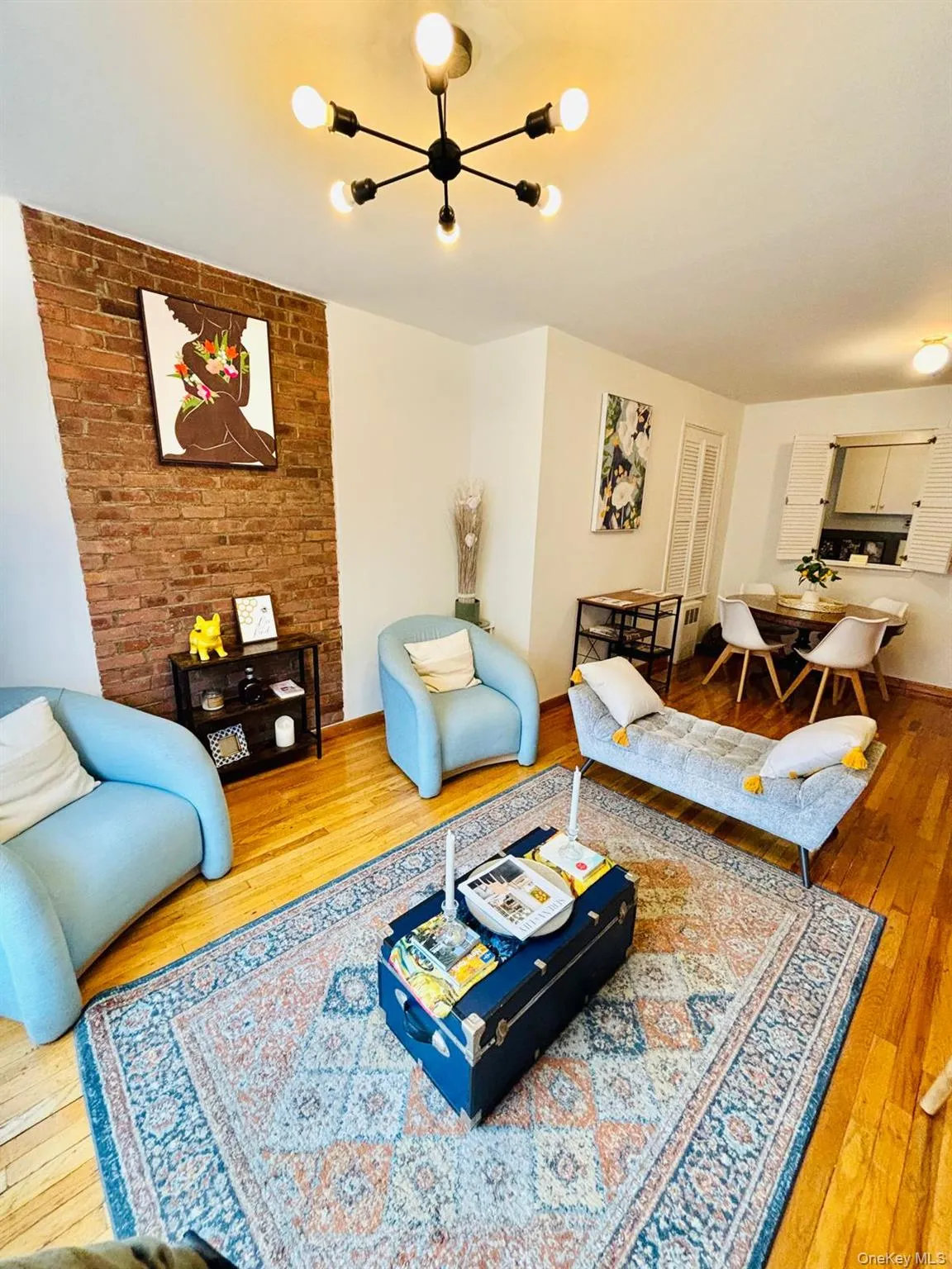 Living room with light wood-style floors and baseboards Living room with light wood-style floors and baseboards