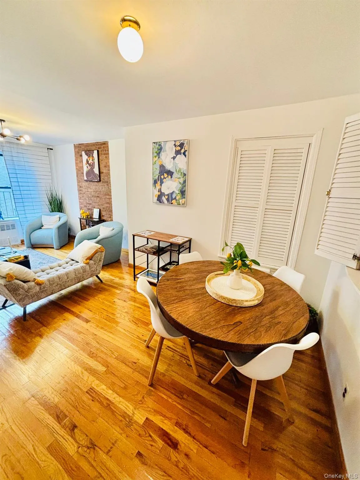 Dining area with light wood-style flooring and baseboards Dining area with light wood-style flooring and baseboards