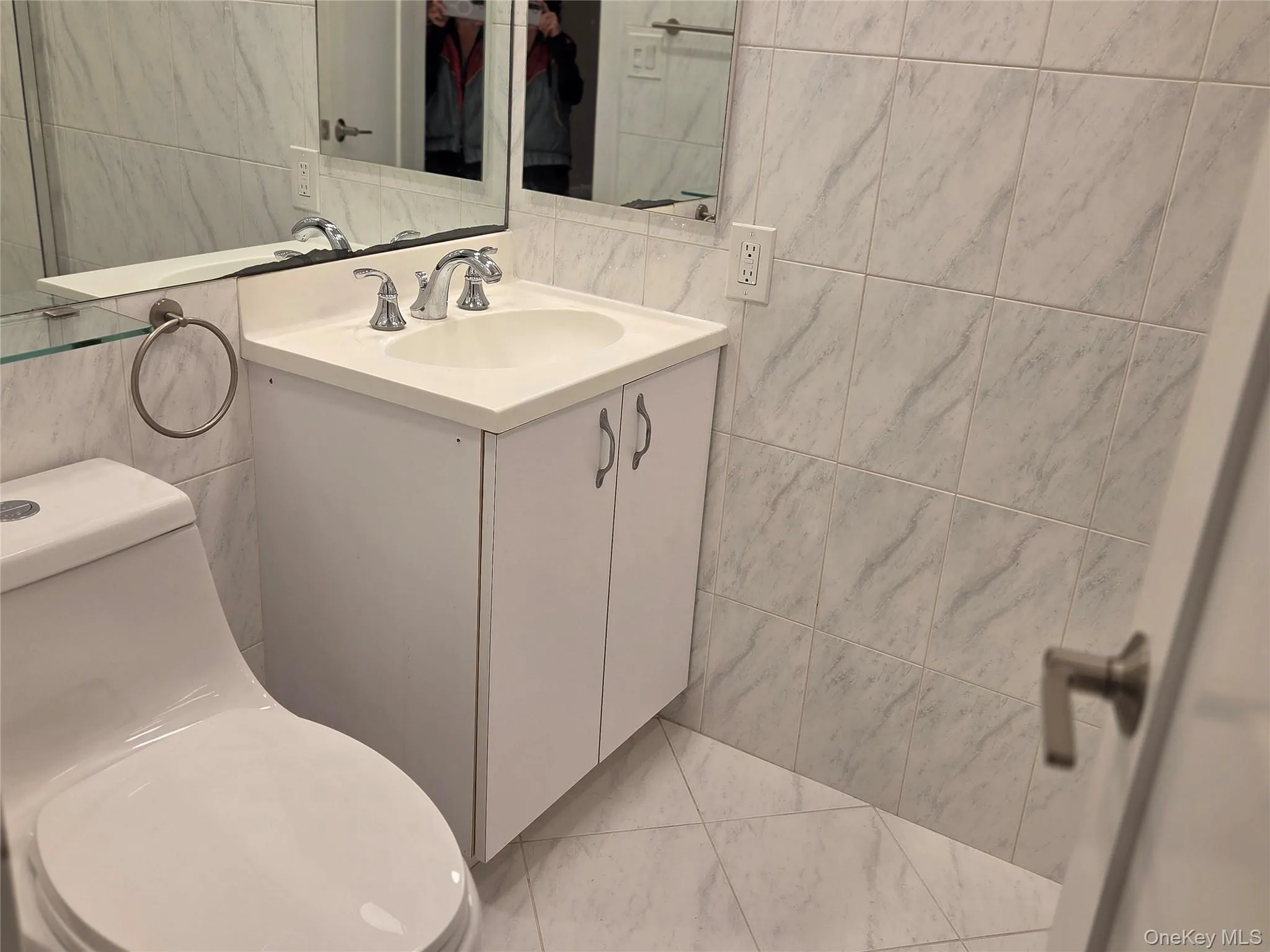 Bathroom with tile walls and vanity Bathroom with tile walls and vanity
