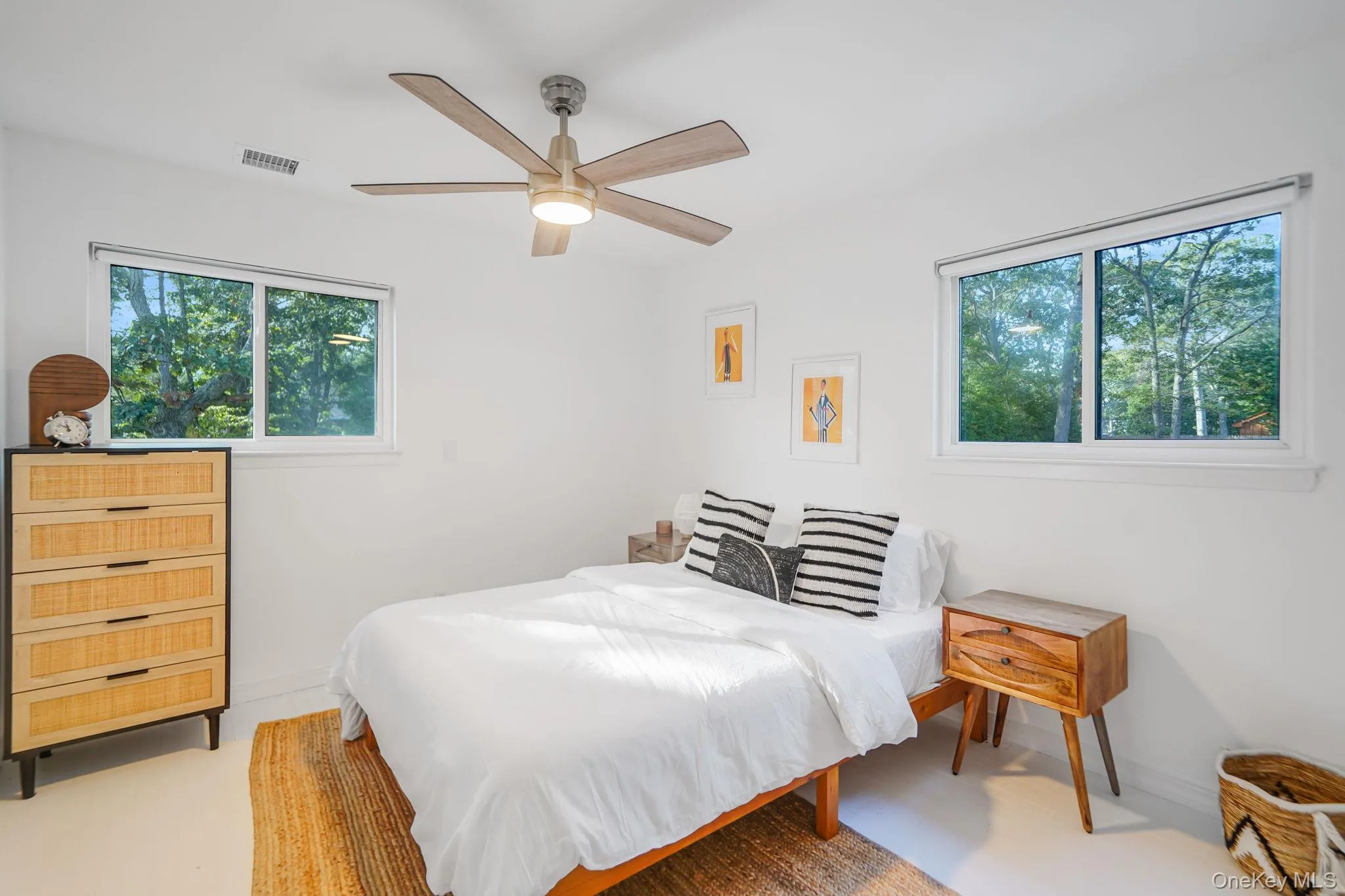 Bedroom featuring a ceiling fan and baseboards Bedroom featuring a ceiling fan and baseboards
