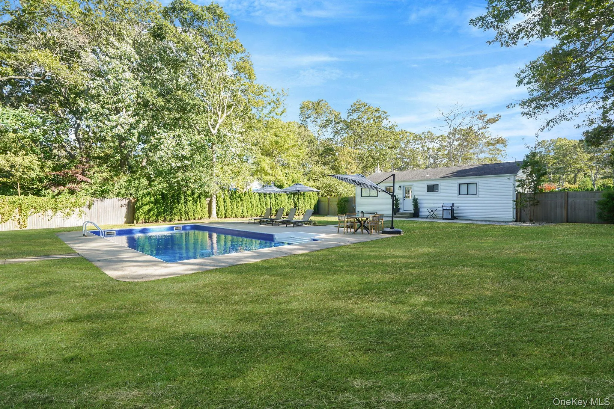 View of swimming pool featuring a fenced backyard and a patio View of swimming pool featuring a fenced backyard and a patio