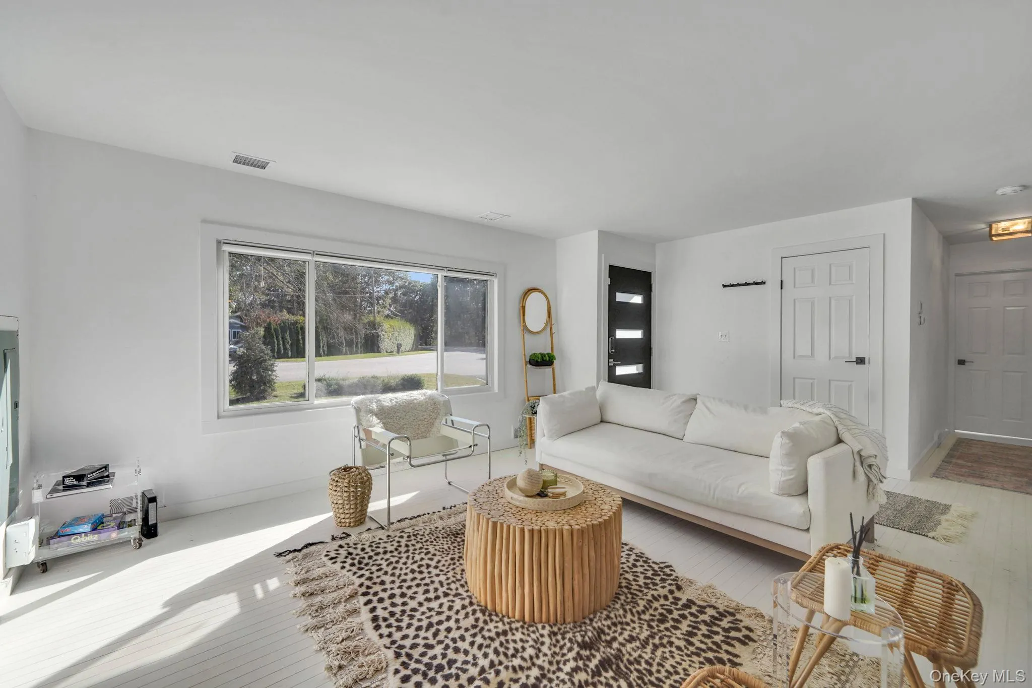 Living area with wood finished floors and baseboards Living area with wood finished floors and baseboards