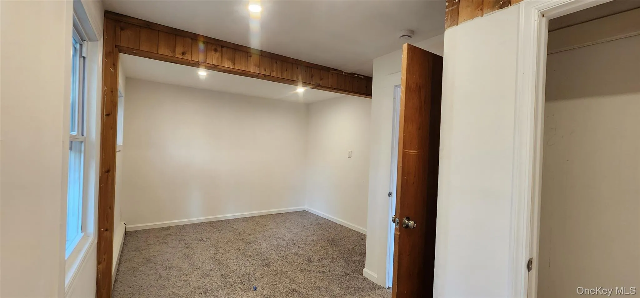 Walk in closet featuring carpet floors Walk in closet featuring carpet floors