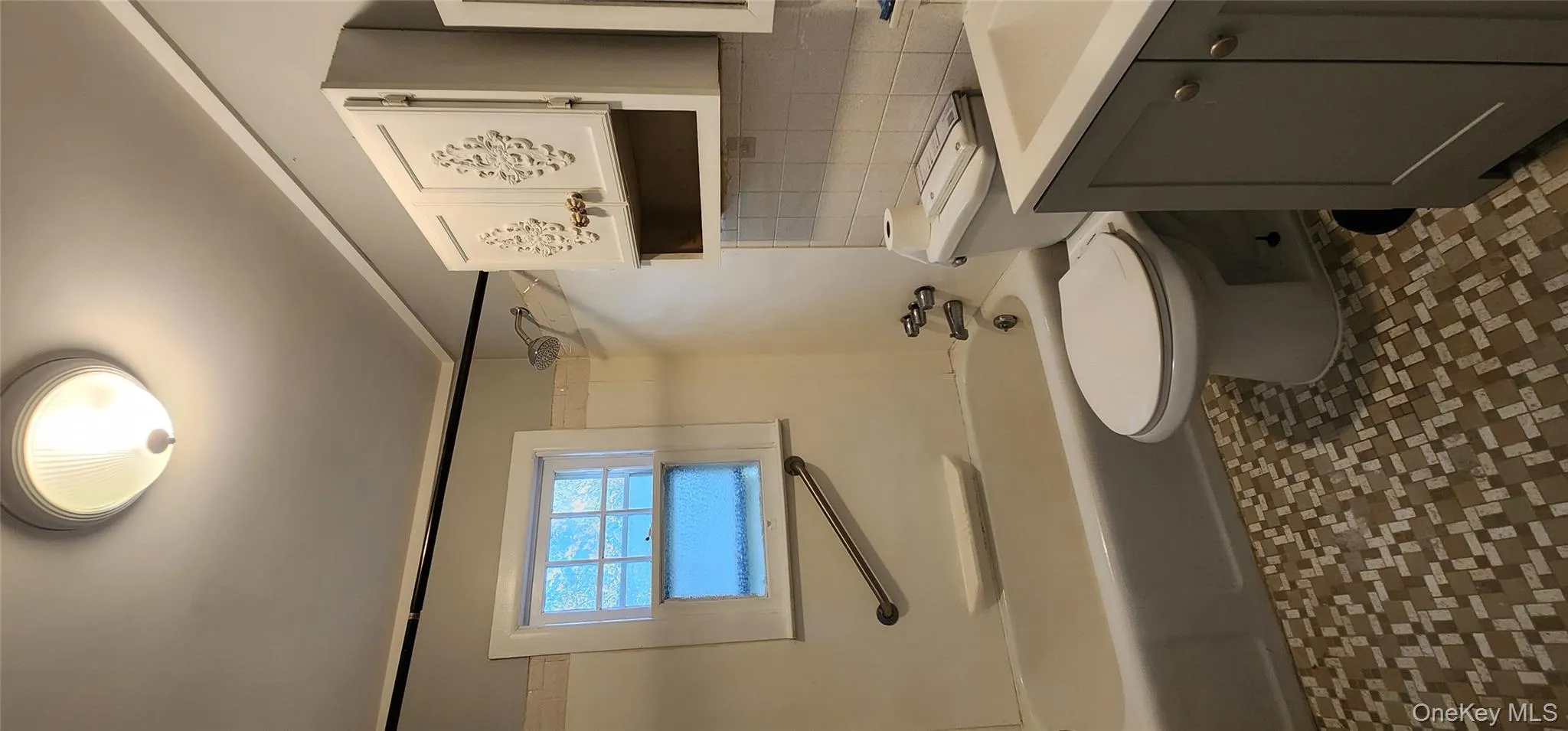 Bathroom with shower / tub combination, vanity, and tasteful backsplash Bathroom with shower / tub combination, vanity, and tasteful backsplash