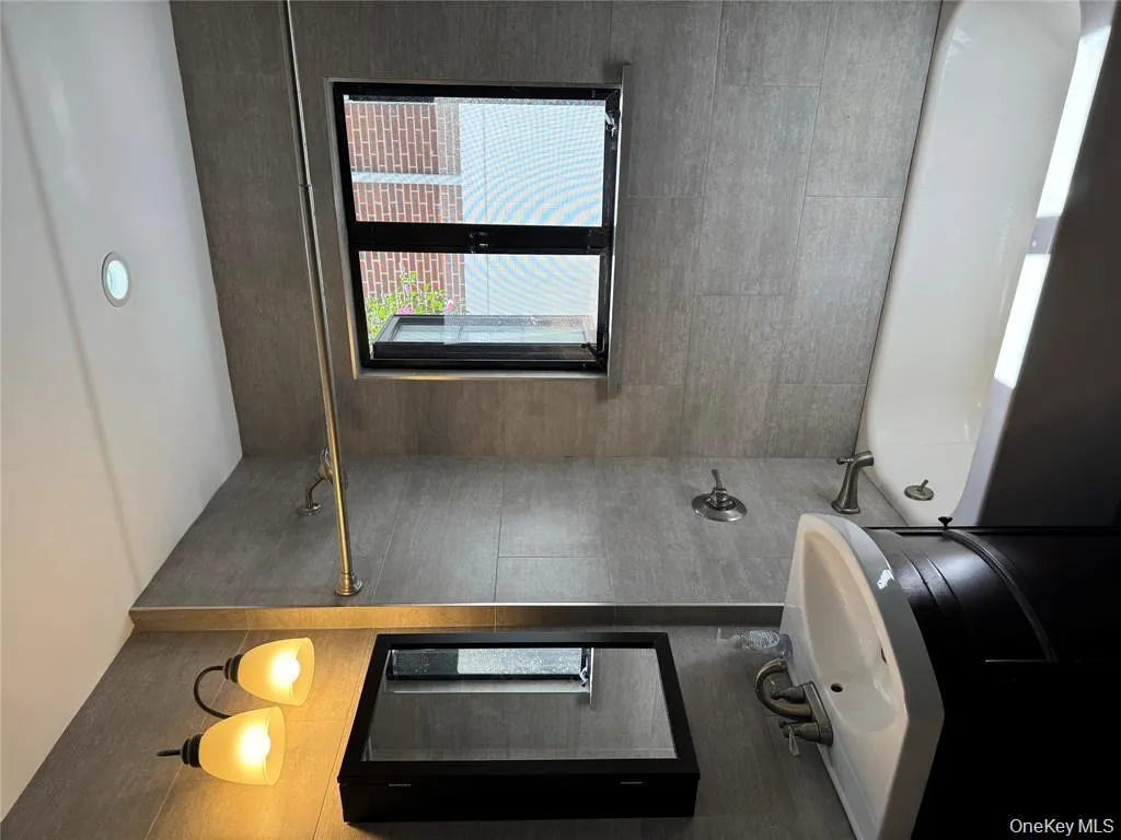 Bathroom with bathing tub / shower combination and vanity Bathroom with bathing tub / shower combination and vanity