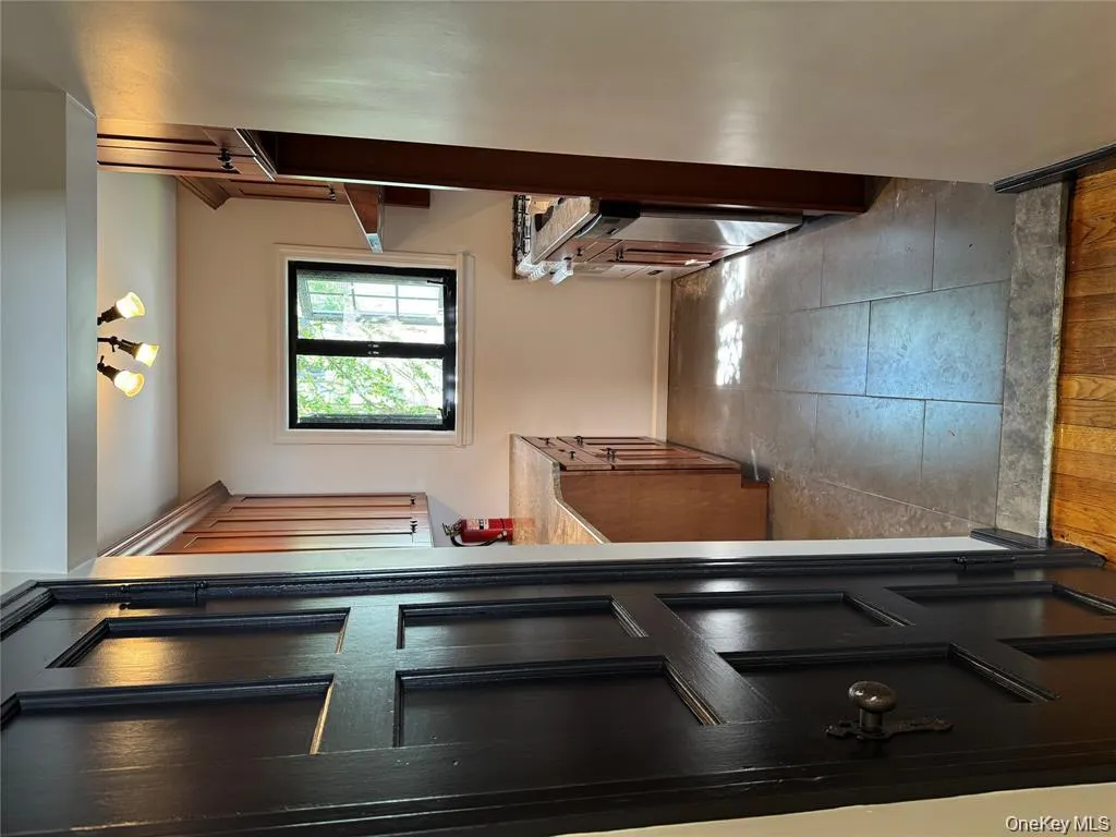 Kitchen with brown cabinets, stove, dishwasher, and light tile patterned floors Kitchen with brown cabinets, stove, dishwasher, and light tile patterned floors