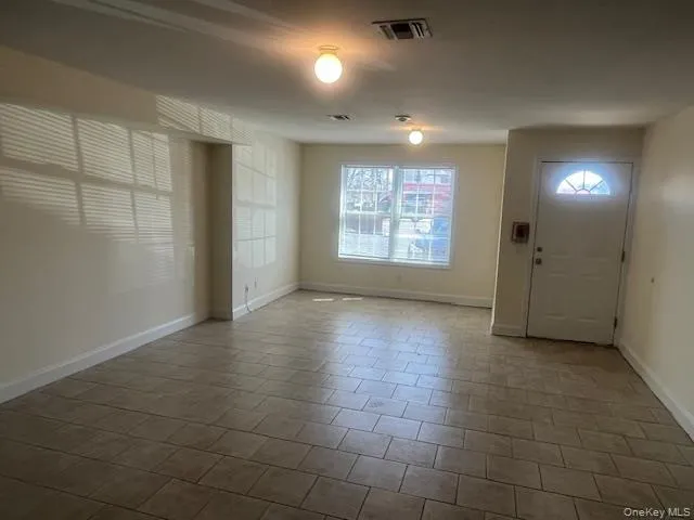 Foyer entrance with baseboards Foyer entrance with baseboards