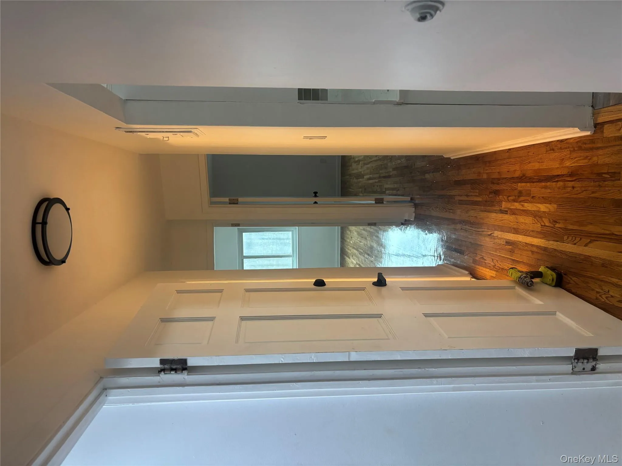 Corridor with dark wood-style flooring and baseboards Corridor with dark wood-style flooring and baseboards
