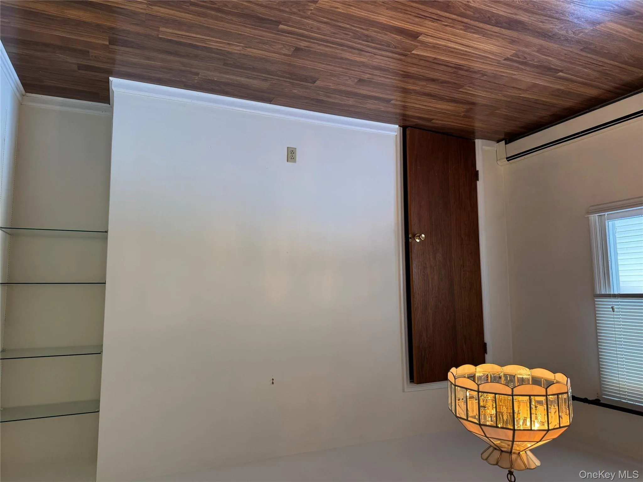 Spare room featuring dark wood finished floors Spare room featuring dark wood finished floors