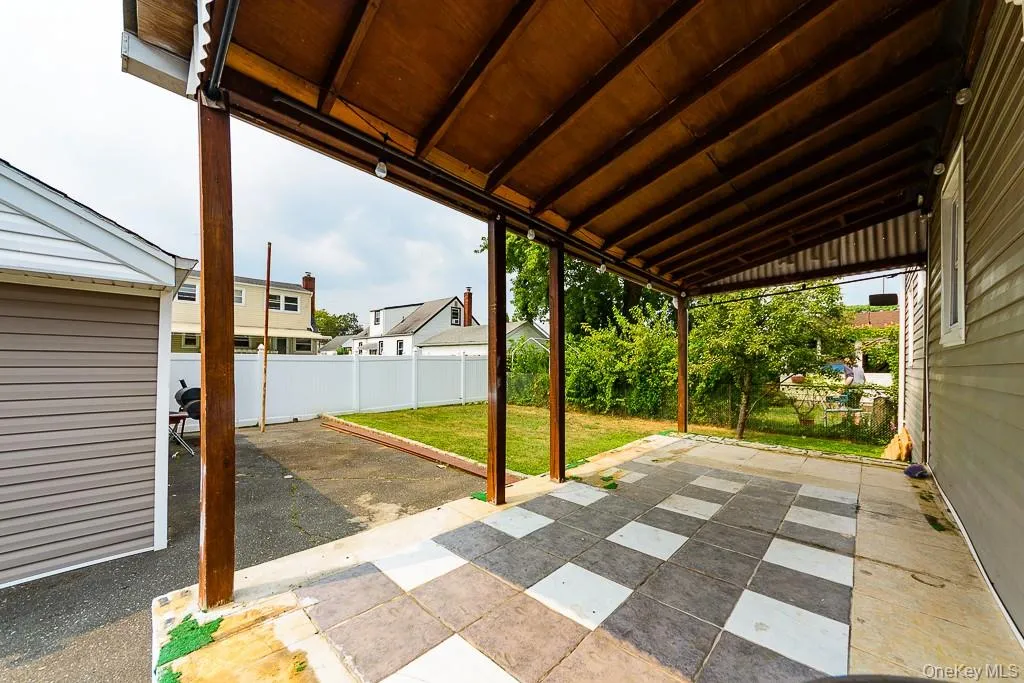Fenced backyard with a patio Fenced backyard with a patio