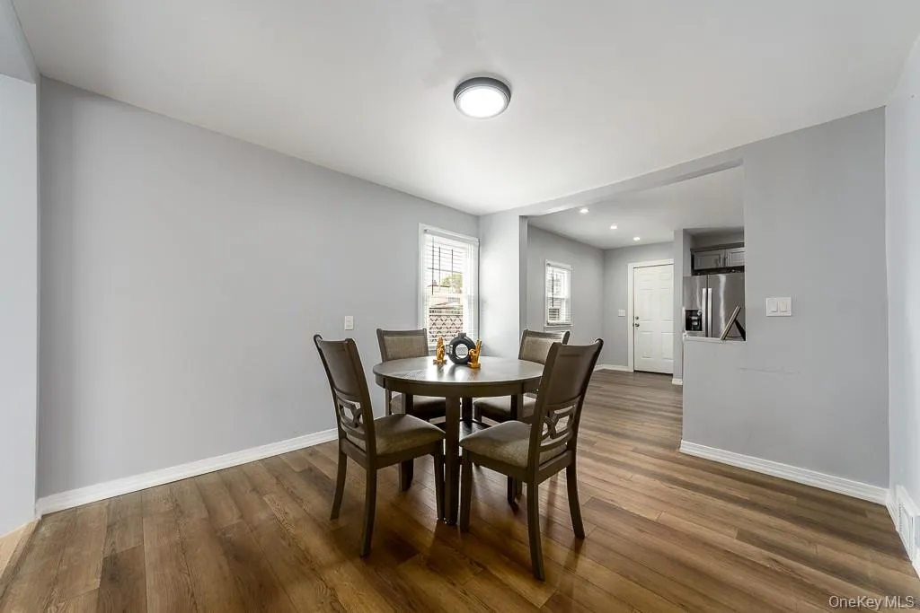 Dining space featuring dark wood-type flooring and recessed lighting Dining space featuring dark wood-type flooring and recessed lighting