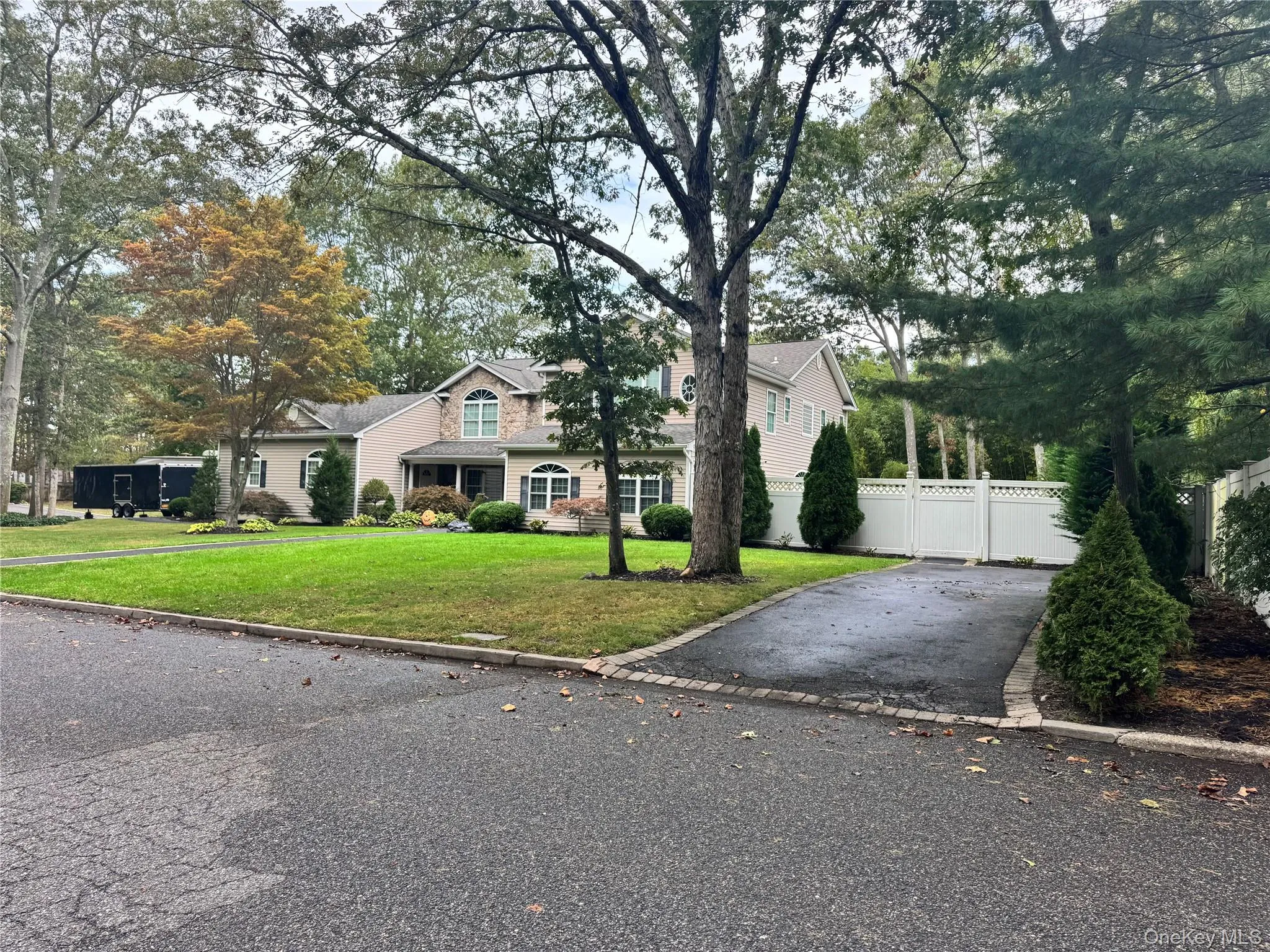 Traditional-style house featuring view of wooded area Traditional-style house featuring view of wooded area