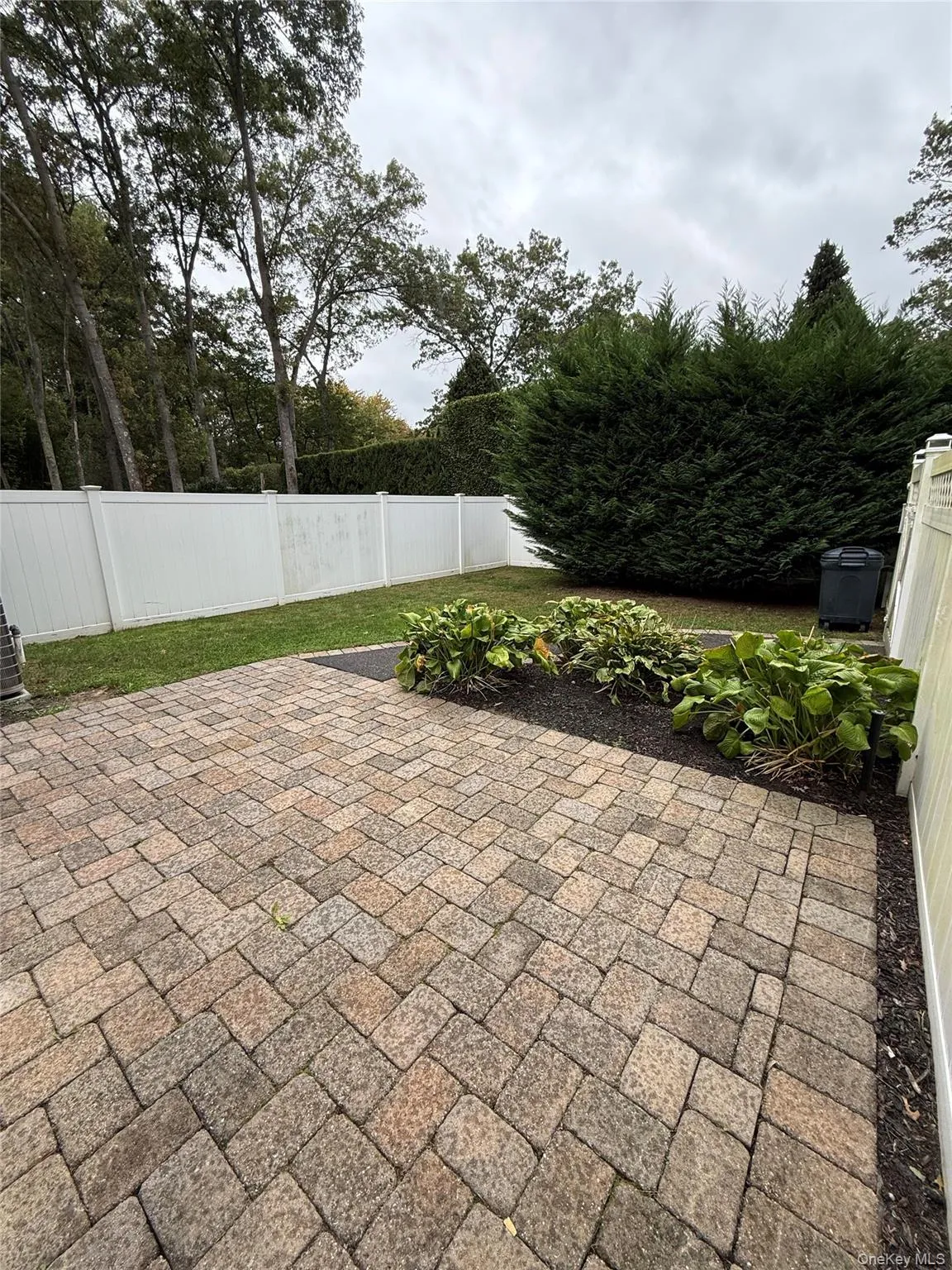 Fenced backyard with a patio Fenced backyard with a patio