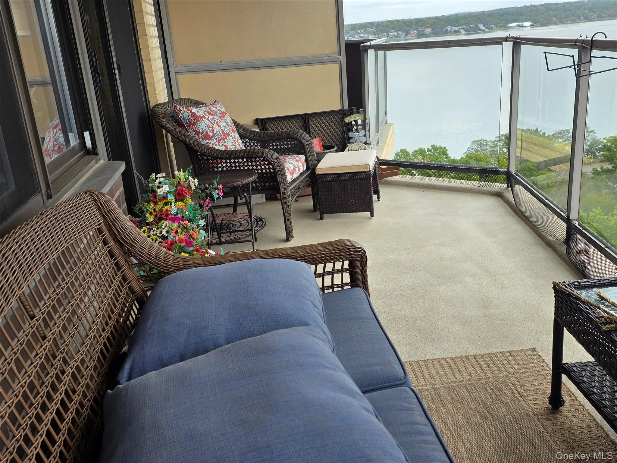 Balcony with a water view and an outdoor hangout area Balcony with a water view and an outdoor hangout area