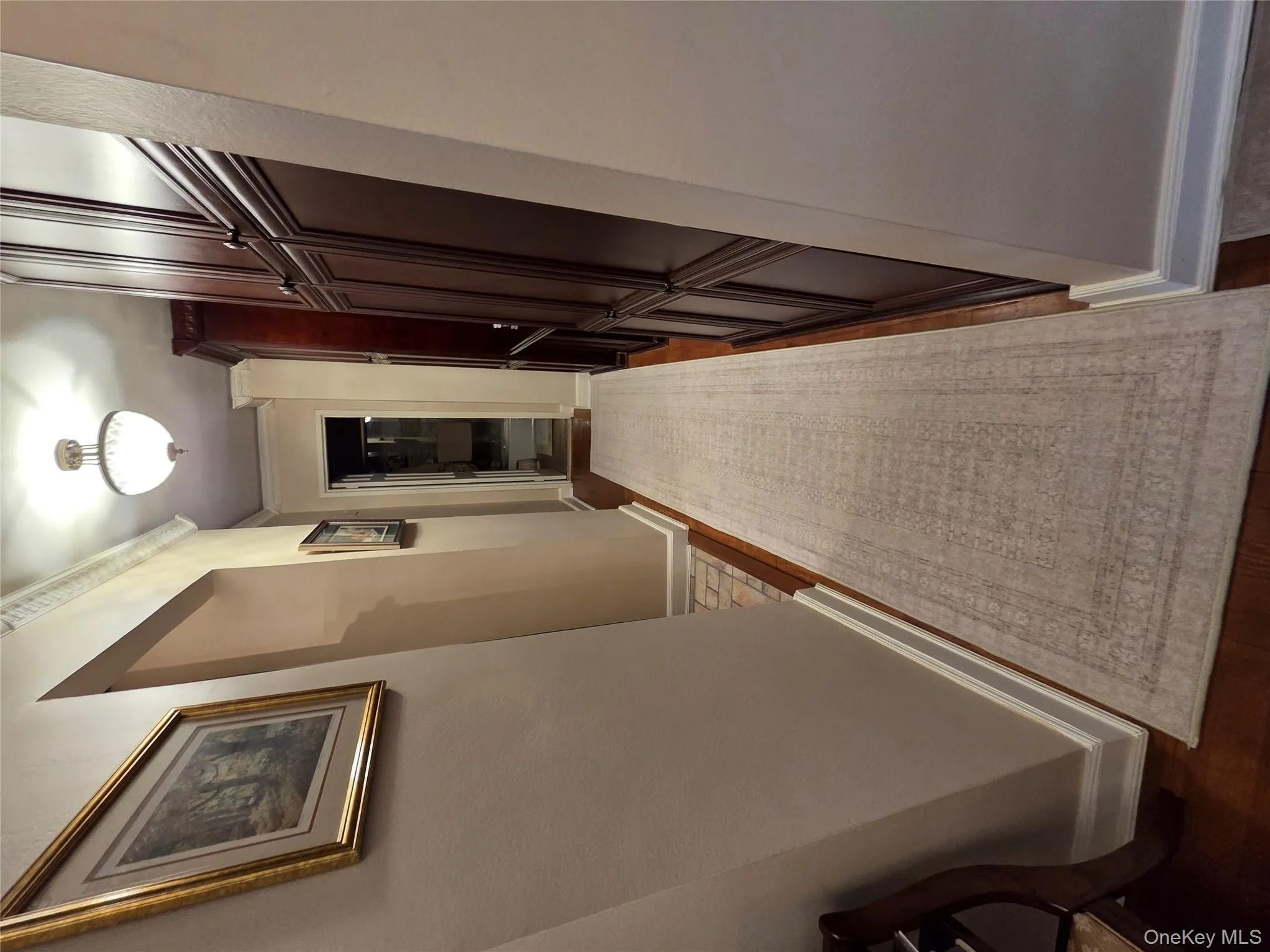 Hall featuring dark wood-type flooring and crown molding Hall featuring dark wood-type flooring and crown molding