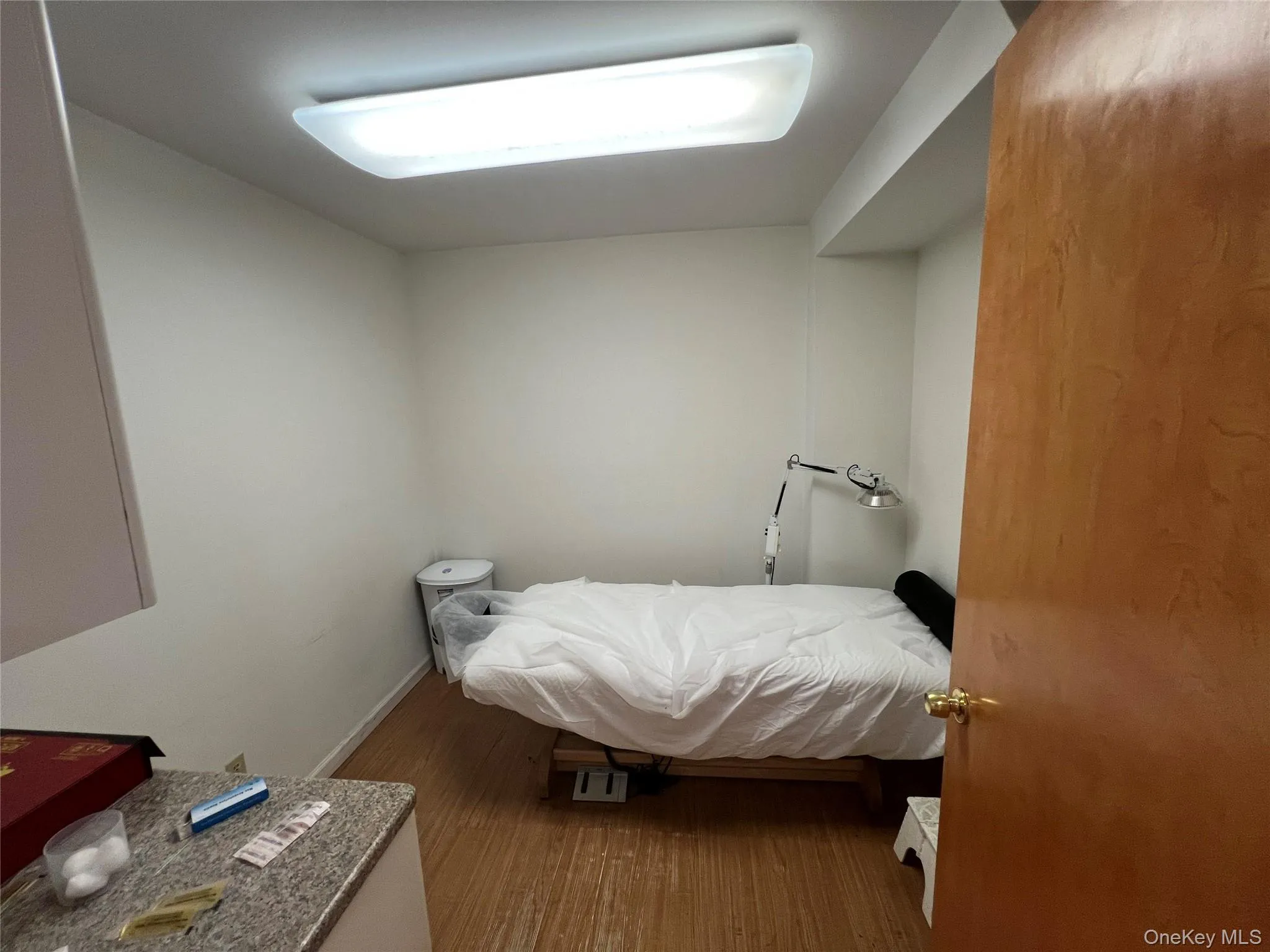Bedroom with wood finished floors and baseboards Bedroom with wood finished floors and baseboards