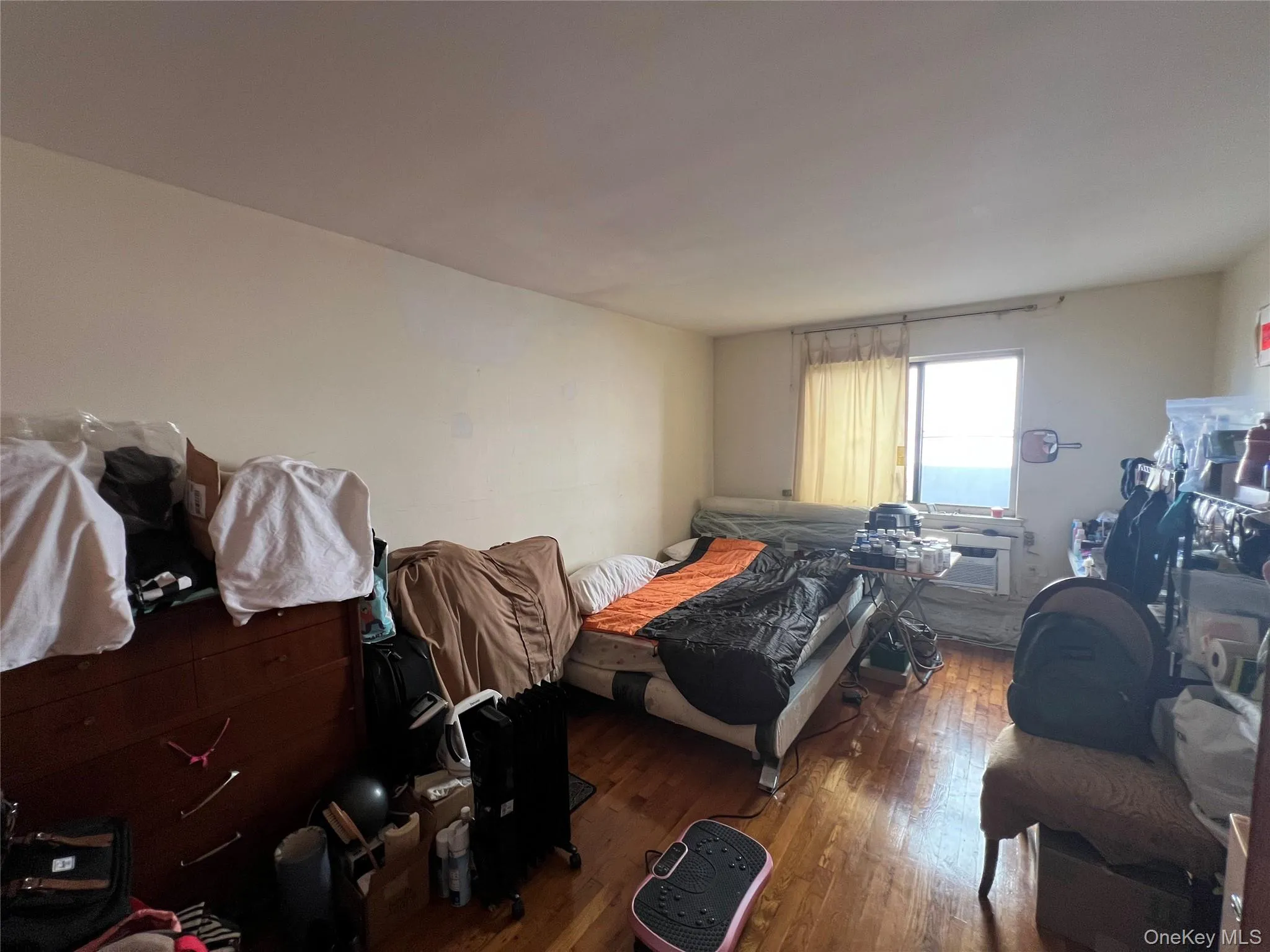 Bedroom with hardwood / wood-style flooring Bedroom with hardwood / wood-style flooring