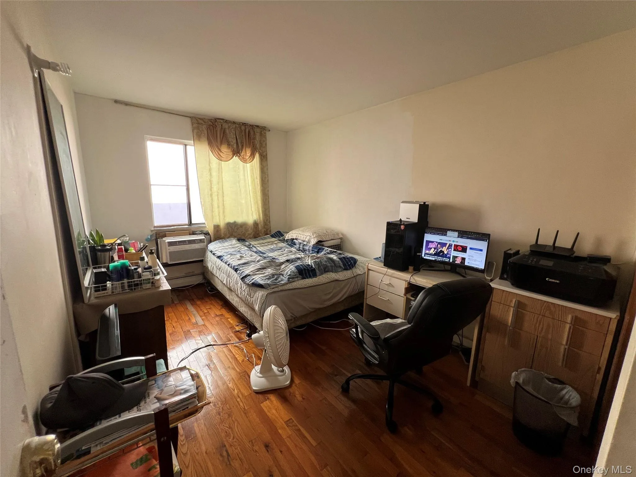 Bedroom with dark wood-style flooring Bedroom with dark wood-style flooring