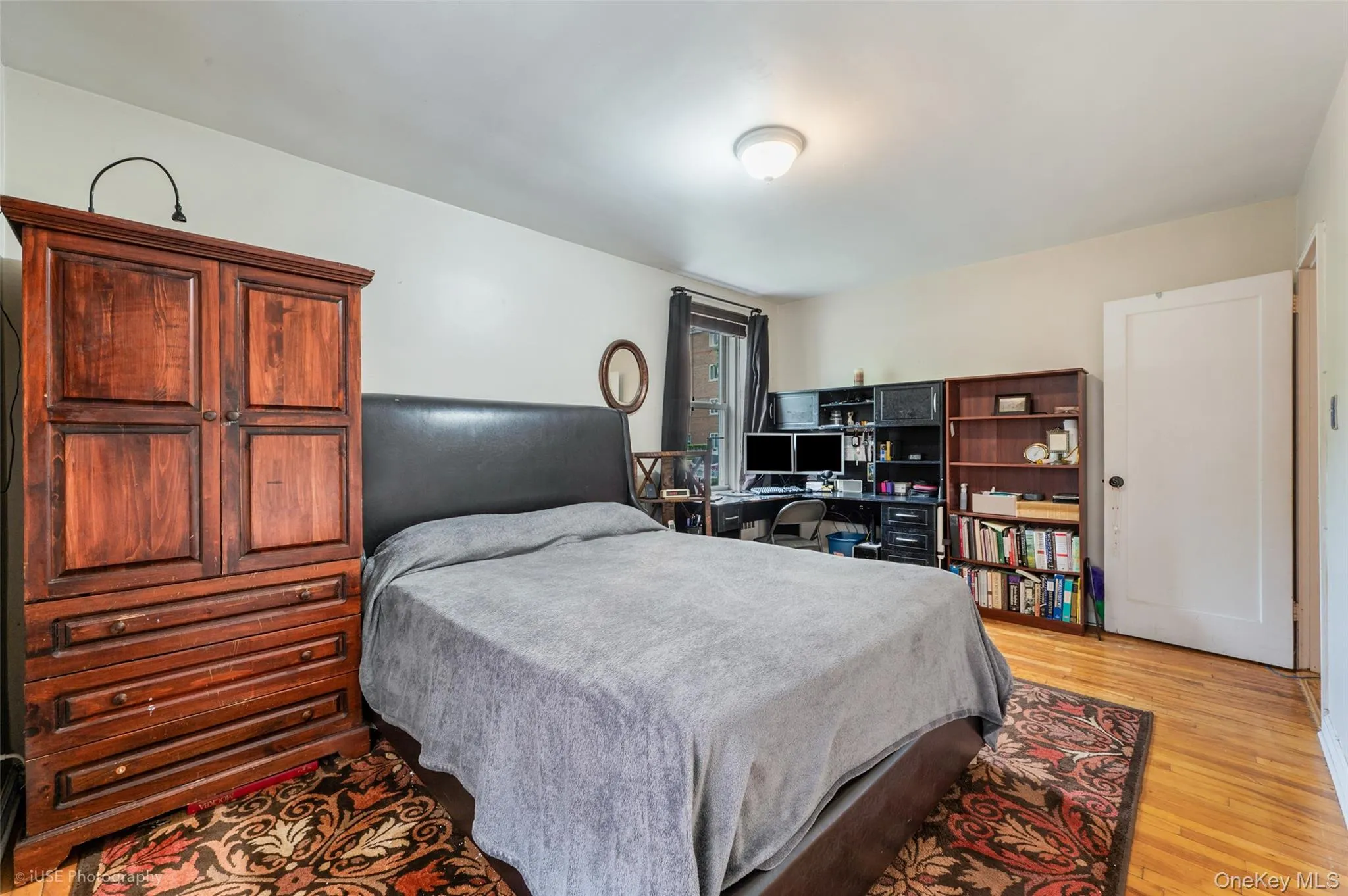 Bedroom featuring light wood-style floors Bedroom featuring light wood-style floors