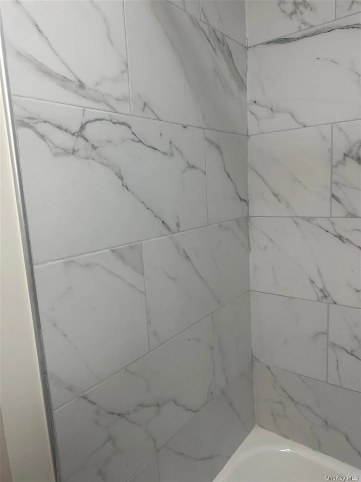 Full bathroom featuring bathtub / shower combination Full bathroom featuring bathtub / shower combination