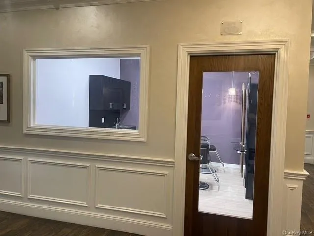 Doorway featuring wood finished floors Doorway featuring wood finished floors