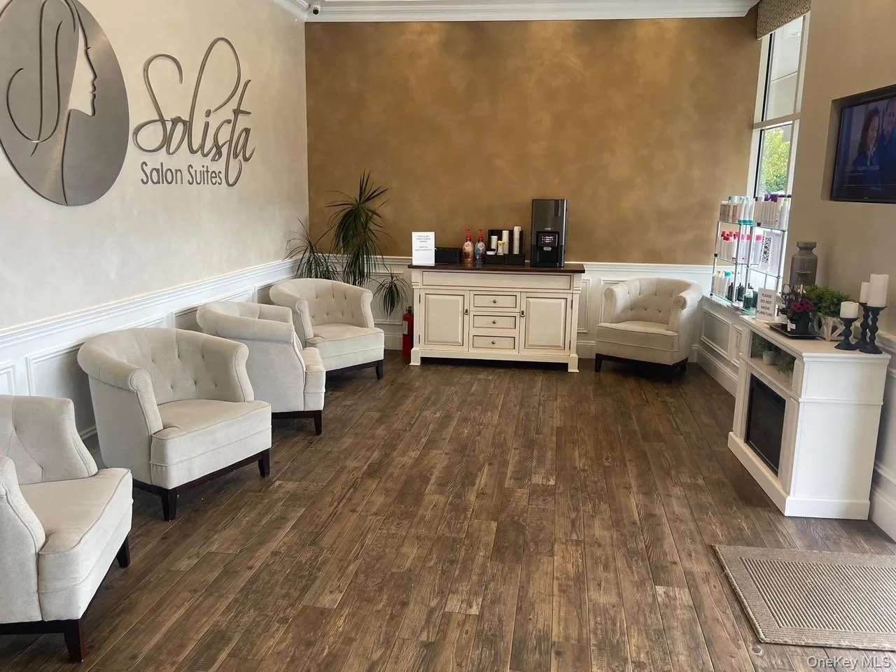 Building lobby with wainscoting, a decorative wall, and crown molding Building lobby with wainscoting, a decorative wall, and crown molding