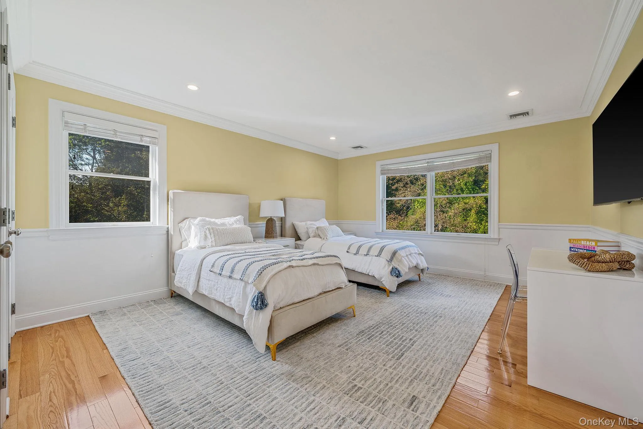 Bedroom featuring light wood finished floors, crown molding, and recessed lighting Bedroom featuring light wood finished floors, crown molding, and recessed lighting