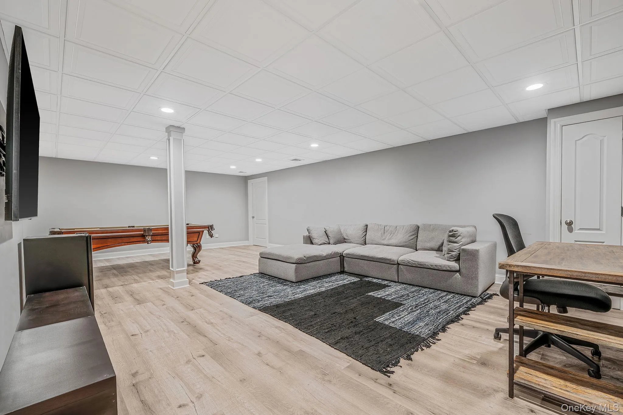 Living area with recessed lighting, wood finished floors, and pool table Living area with recessed lighting, wood finished floors, and pool table