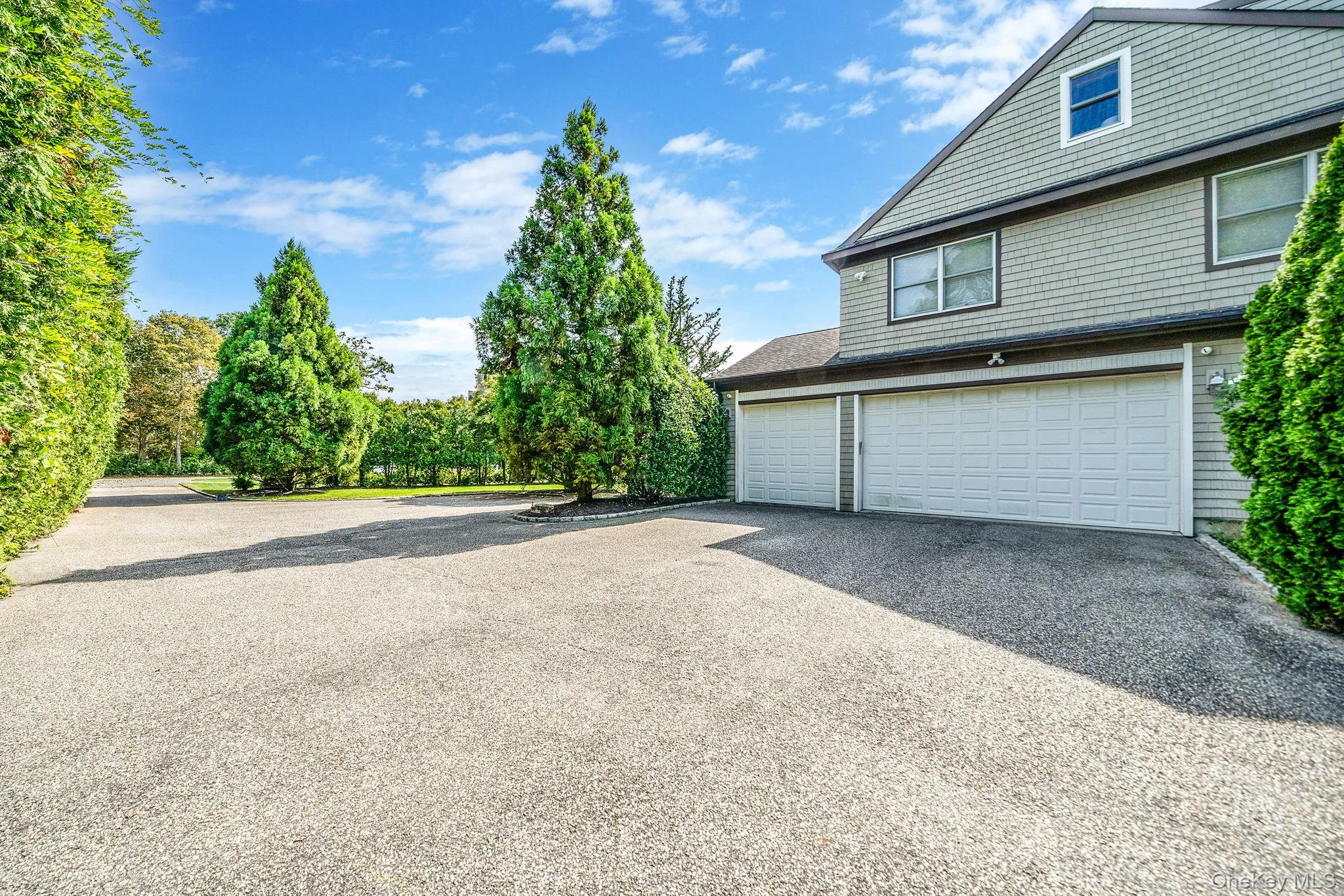 Garage with asphalt driveway Garage with asphalt driveway