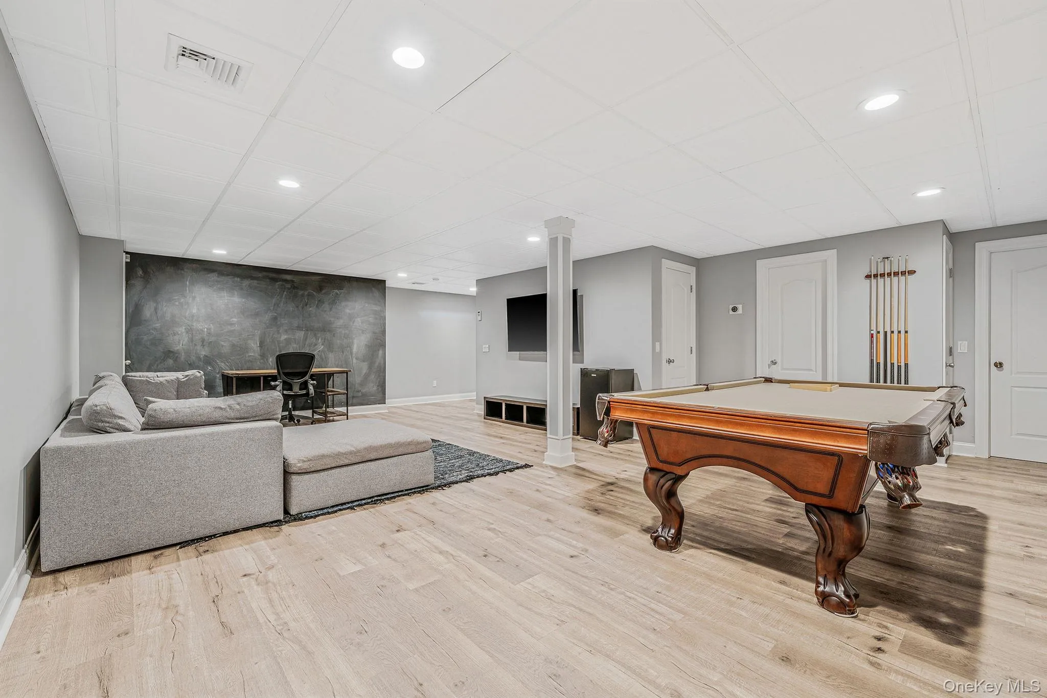 Recreation room featuring billiards, light wood finished floors, recessed lighting, and a drop ceiling Recreation room featuring billiards, light wood finished floors, recessed lighting, and a drop ceiling