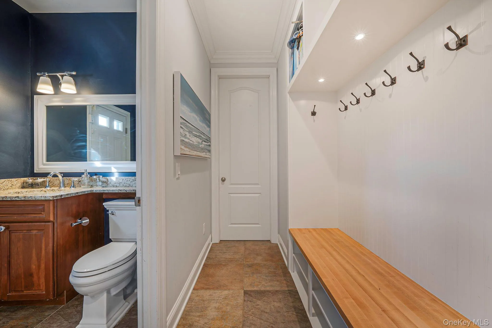 Mudroom featuring crown molding and baseboards Mudroom featuring crown molding and baseboards