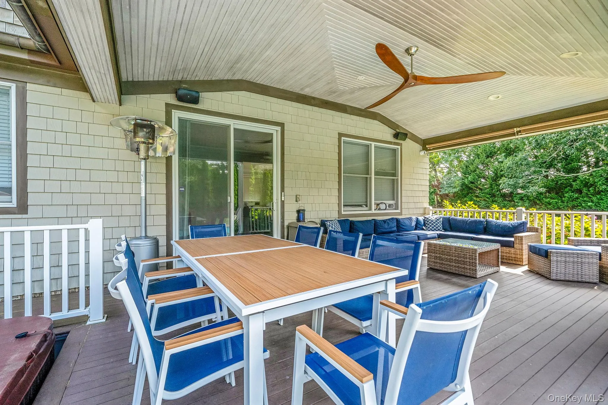 Wooden deck with outdoor lounge area, outdoor dining area, and ceiling fan Wooden deck with outdoor lounge area, outdoor dining area, and ceiling fan