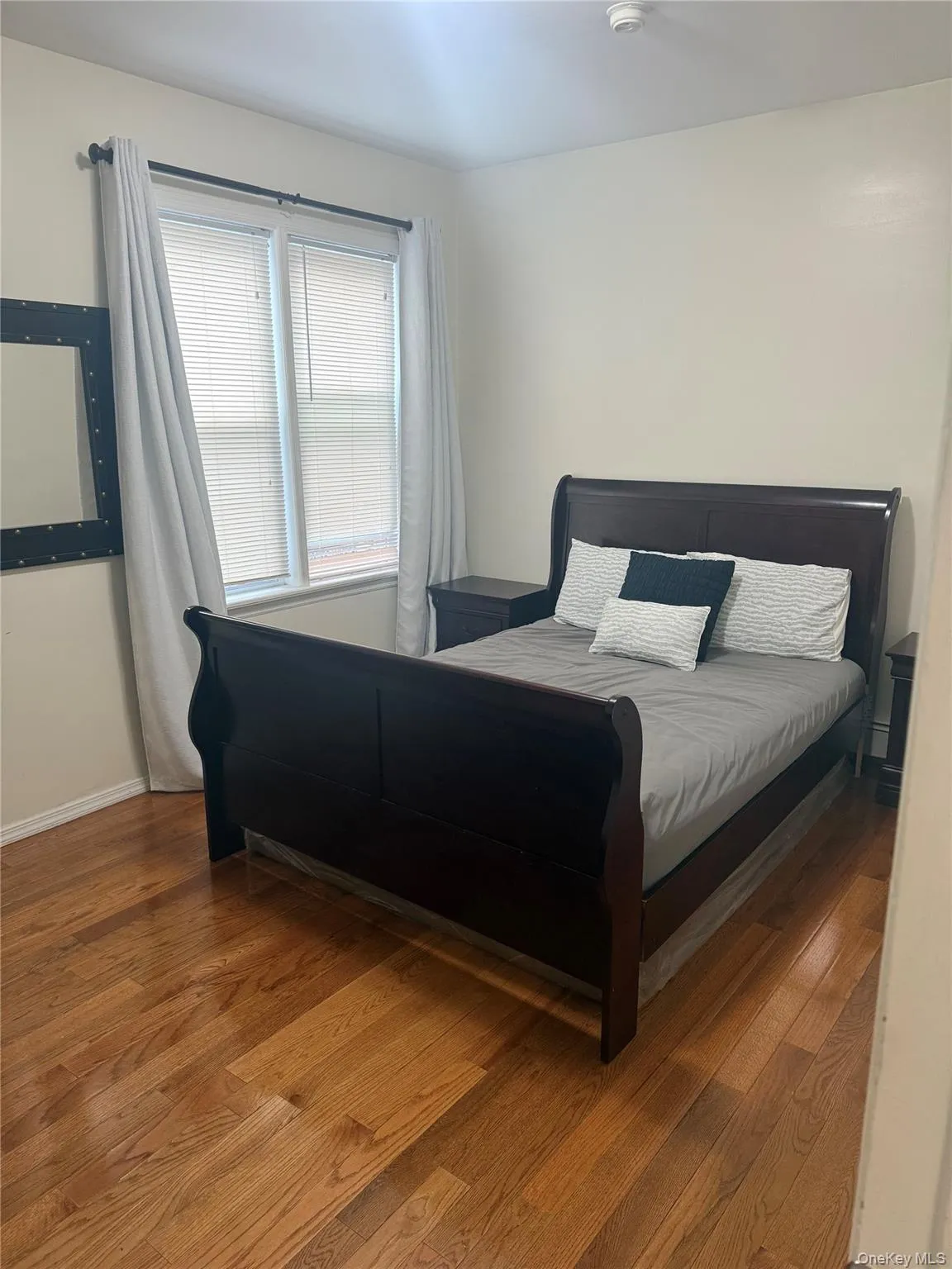 Bedroom with wood finished floors Bedroom with wood finished floors