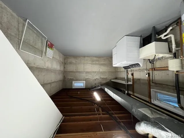 Basement featuring a sink and separate washer and dryer Basement featuring a sink and separate washer and dryer