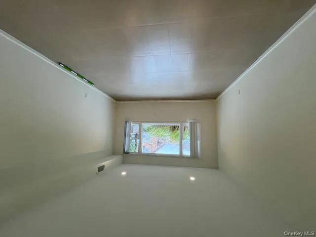 Unfurnished room featuring recessed lighting and light flooring Unfurnished room featuring recessed lighting and light flooring