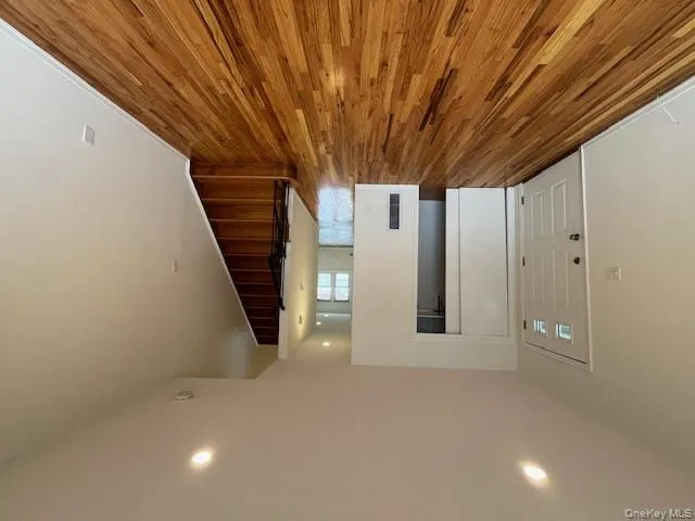 Foyer featuring recessed lighting, stairway, and wood finished floors Foyer featuring recessed lighting, stairway, and wood finished floors